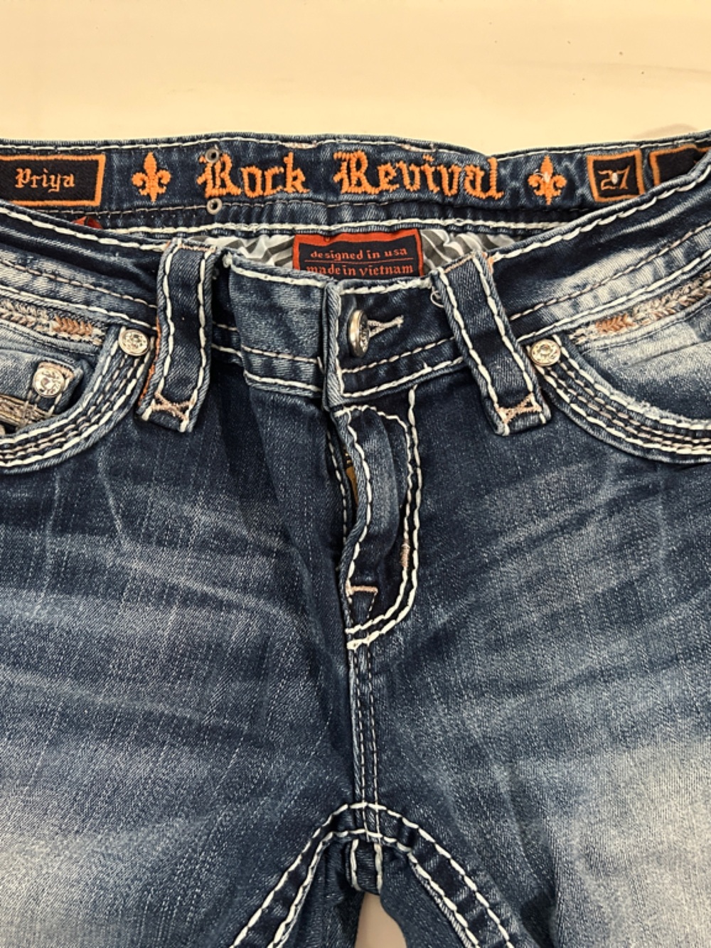 Rock Revival Distressed Blue Denim Priya Boot cut Jeans with Orange Logo Trim